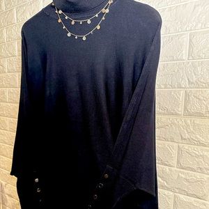 Woman’s poncho turtle neck sweater